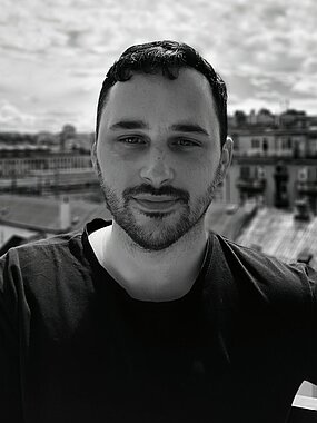 photograph of Jose Aguilar infront of a city scape